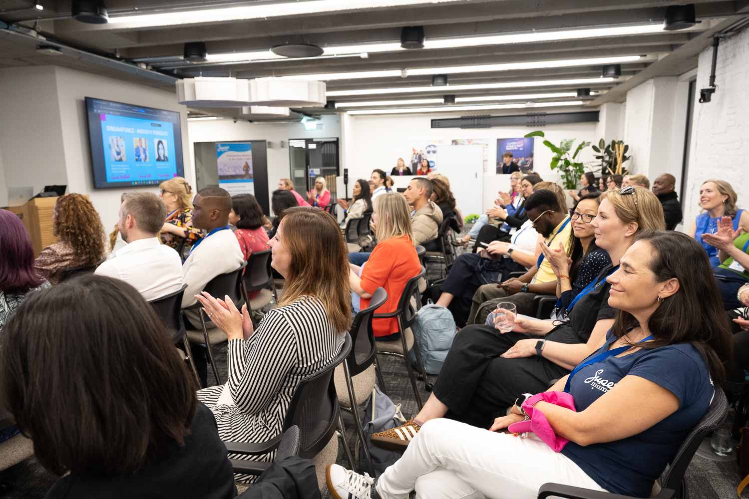 A full room of community members at a Supermums community event